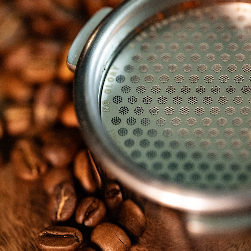 FIX COFFEE titanium puck screen, 0.7mm, with coffee beans. Espresso tool.