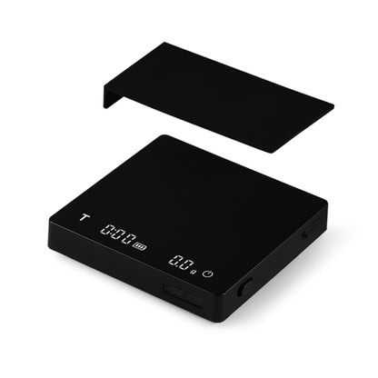 The MHW-3BOMBER Cube Coffee Scale 2.0 Mini boasts a sleek black design with a removable cover, high precision, an LCD display for weight and timer functions, and USB rechargeability for convenience.
