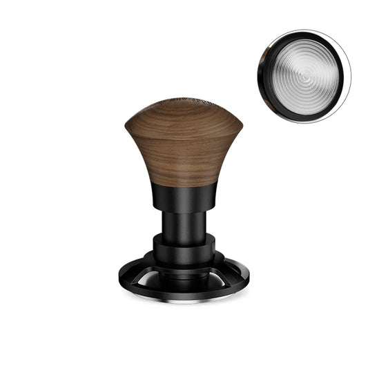 The MHW-3BOMBER Armor Series Coffee Tamper 2.0 boasts a wooden handle and black metal base with a flat, textured underside. Its triple spring design blends functionality and aesthetics, ensuring constant pressure and precision in every use.