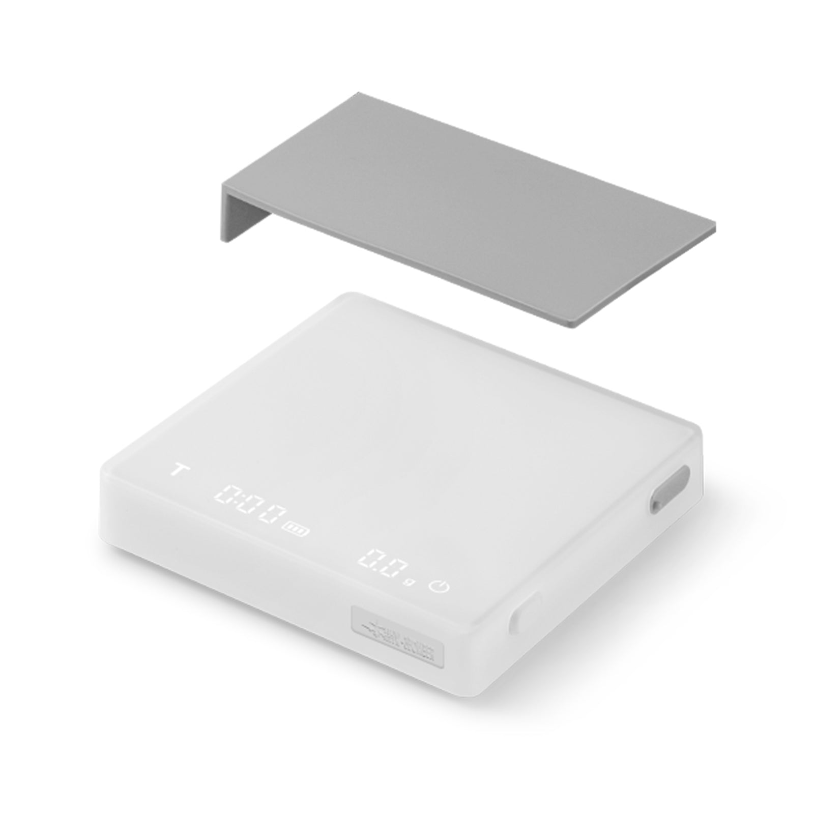 The MHW-3BOMBER Cube Coffee Scale 2.0 Mini is a white digital scale with a minimalist rectangular design and high-precision display, USB rechargeable features, and includes a separate floating gray cover.