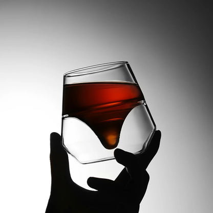MHW-3BOMBER DW Series glass cup with liquor, double-walled, heat resistant. Held by hand.