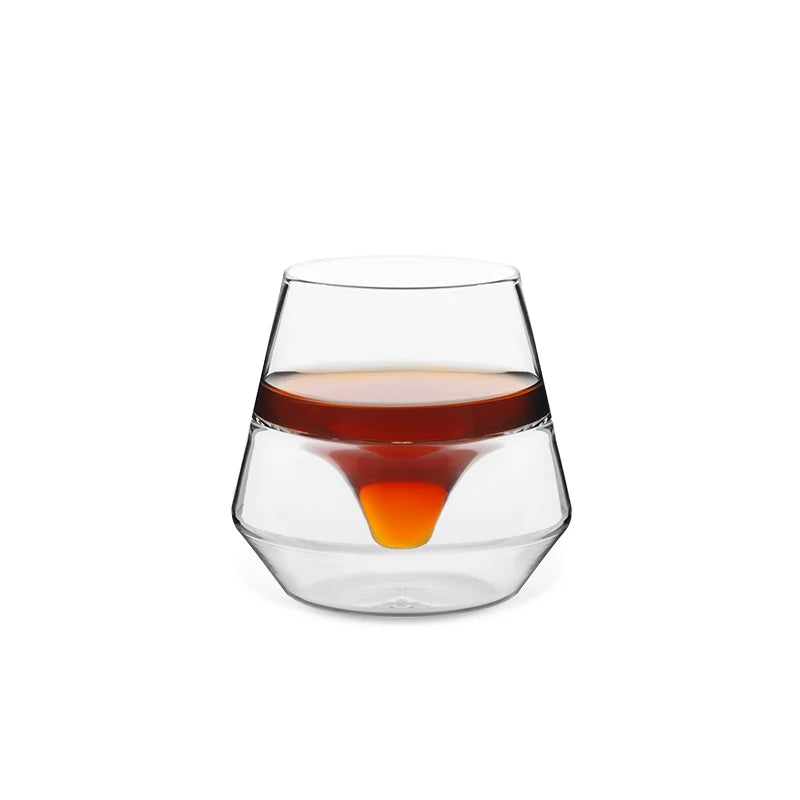 MHW-3BOMBER DW Series glass cup with unique design and coffee-colored liquid. Double-walled, heat-resistant borosilicate glass.