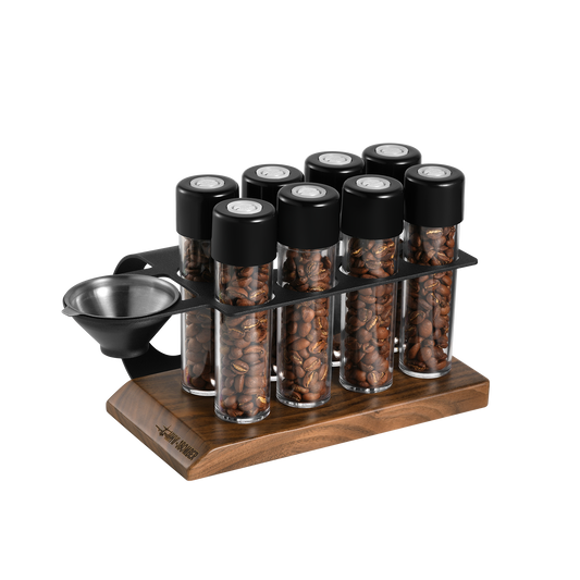 MHW-3BOMBER coffee energy tubes set. Clear tubes with black lids in a wooden and metal stand. Holds coffee beans.