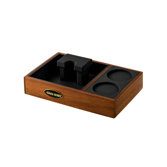 MHW-3BOMBER espresso tamping station, wooden, with black portafilter holder and tamping mat.