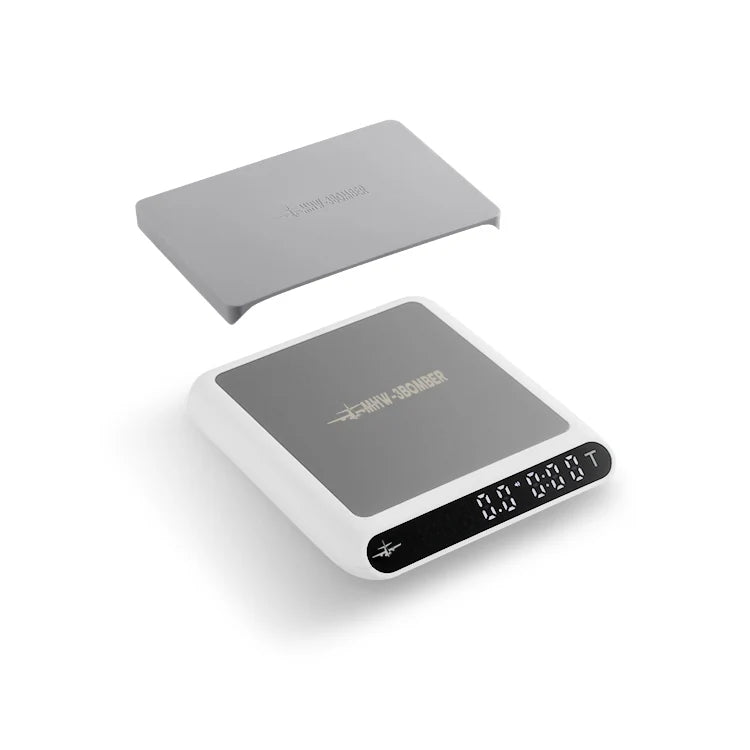 MHW-3BOMBER smart espresso scale with timer. White & gray, shows digital display. Includes tray. Accurate measurements.